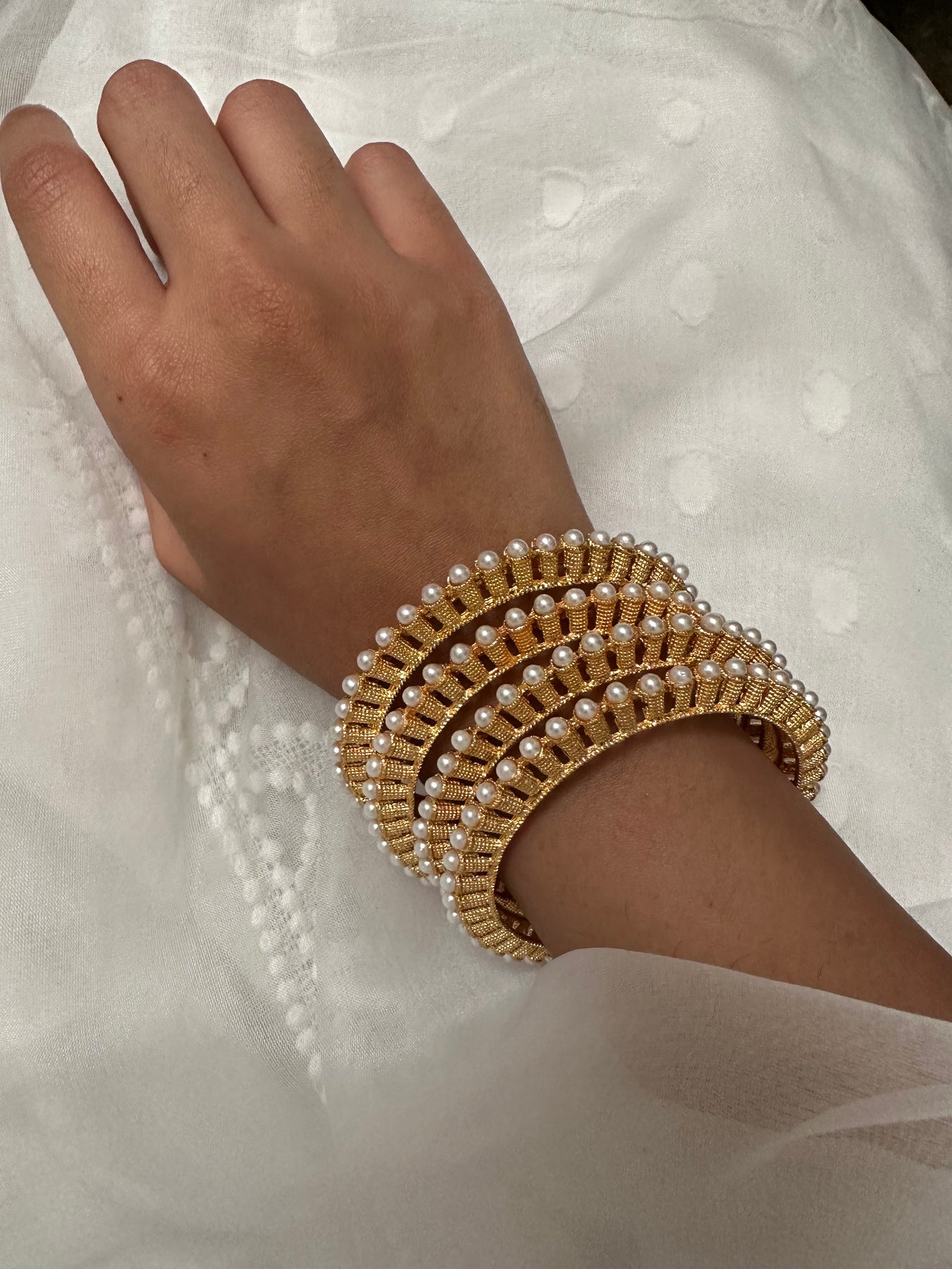 Buy White Pearl And Metal Cuff Bracelet by Anaash Online at Aza Fashions.